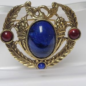Swan brooch pin vintage goldtone with large blue and  red circular stones